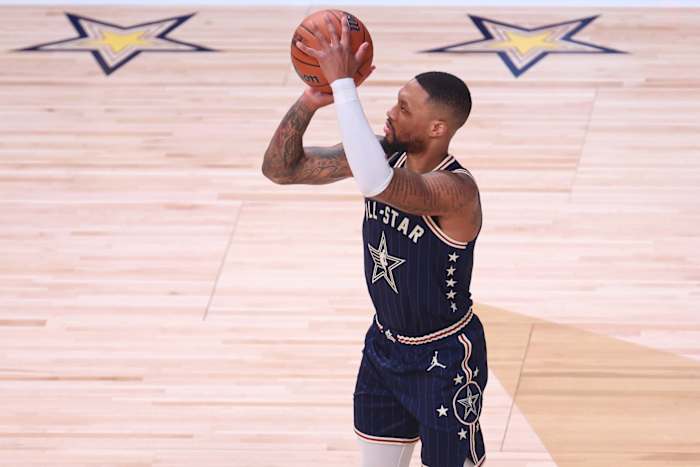 Eastern Conference guard Damian Lillard (0) of the Milwaukee Bucks attempts a three point basket against the Western Conference All-Stars during the third quarter in the 73rd NBA All Star game at Gainbridge Fieldhouse.